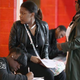 People seeking employment fill out applications at a job fair in Detroit April 23, 2014. Experts say having the skills to negotiate things like salary are important to have from the start of one’s career.
Joshua Lott/Getty Images